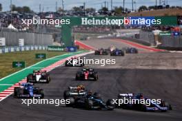 (L to R): George Russell (GBR) Mercedes AMG F1 W14 and Esteban Ocon (FRA) Alpine F1 Team A523 battle for position. 22.10.2023. Formula 1 World Championship, Rd 19, United States Grand Prix, Austin, Texas, USA, Race Day.