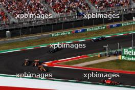Carlos Sainz Jr (ESP) Ferrari SF-23 leads Lando Norris (GBR) McLaren MCL60. 21.10.2023. Formula 1 World Championship, Rd 19, United States Grand Prix, Austin, Texas, USA, Sprint Day.