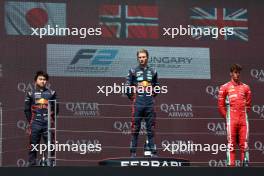 The podium (L to R): Ayumu Iwasa (JPN) Dams, second; Dennis Hauger (DEN) MP Motorsport, race winner; Oliver Bearman (GBR) Prema Racing, third. 22.07.2023. FIA Formula 2 Championship, Rd 10, Budapest, Hungary, Sprint Race, Saturday.