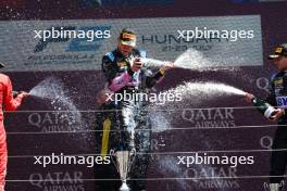 (L to R): Race winner Jack Doohan (AUS) Virtuosi Racing celebrates on the podium with third placed Victor Martins (FRA) ART Grand Prix. 23.07.2023. FIA Formula 2 Championship, Rd 10, Budapest, Hungary, Feature Race, Sunday.