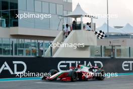 Race winner Frederik Vesti (DEN) Prema Racing takes the chequered flag at the end of the race. 25.11.2023. Formula 2 Championship, Rd 14, Yas Marina Circuit, Abu Dhabi, UAE, Sprint Race, Saturday.