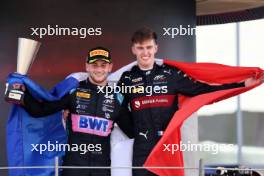 (L to R): Rookie of the year Victor Martins (FRA) ART Grand Prix celebrates with F2 Champion Theo Pourchaire (FRA) ART Grand Prix on the podium. 26.11.2023. Formula 2 Championship, Rd 14, Yas Marina Circuit, Abu Dhabi, UAE, Feature Race, Sunday.