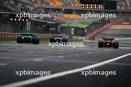 Daniel Ricciardo (AUS) RB VCARB 01; Sergio Perez (MEX) Red Bull Racing RB20; and Valtteri Bottas (FIN) Sauber C44. 19.04.2024. Formula 1 World Championship, Rd 5, Chinese Grand Prix, Shanghai, China, Sprint Qualifying Day.