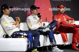 (L to R): Sergio Perez (MEX) Red Bull Racing; Max Verstappen (NLD) Red Bull Racing; and Charles Leclerc (MON) Ferrari, in the post race FIA Press Conference. 09.03.2024. Formula 1 World Championship, Rd 2, Saudi Arabian Grand Prix, Jeddah, Saudi Arabia, Race Day.