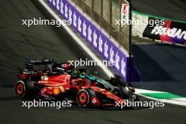 Charles Leclerc (MON) Ferrari SF-24 and Lewis Hamilton (GBR) Mercedes AMG F1 W15 battle for position. 09.03.2024. Formula 1 World Championship, Rd 2, Saudi Arabian Grand Prix, Jeddah, Saudi Arabia, Race Day.